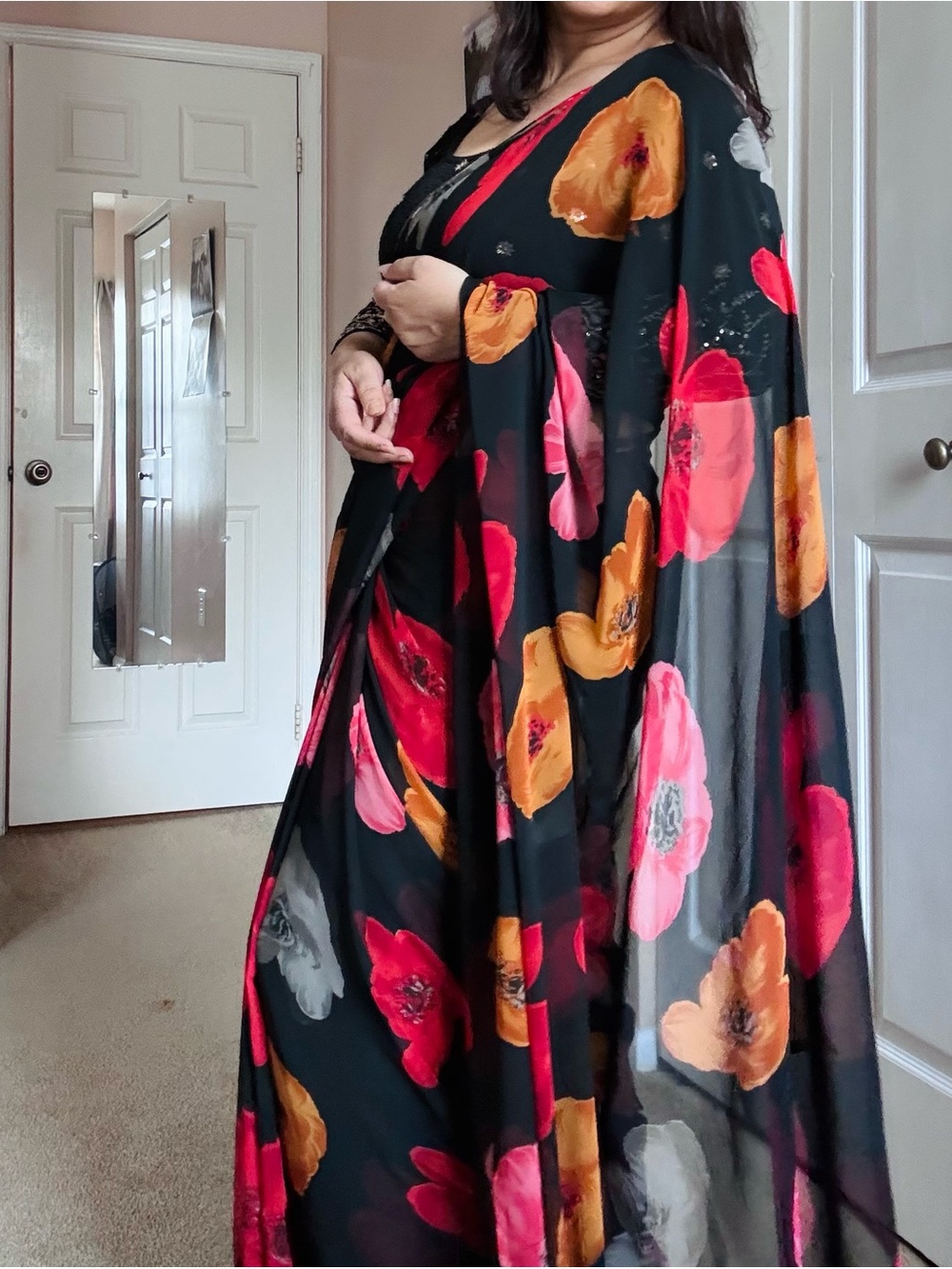 Black Floral Sheer Saree with Bold Red & Orange Blooms and black stretchy blouse - Picture 3 of 5